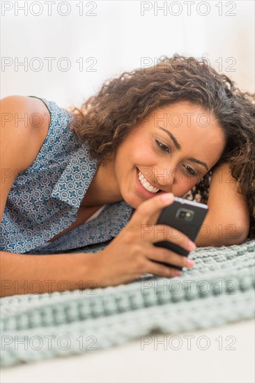 Young woman using smartphone.