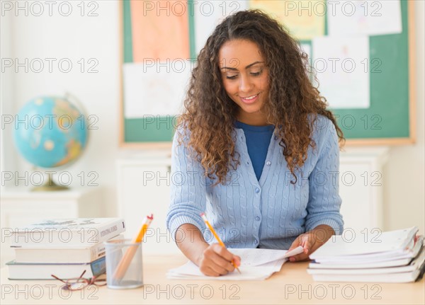 Portrait of elementary school teacher in class.