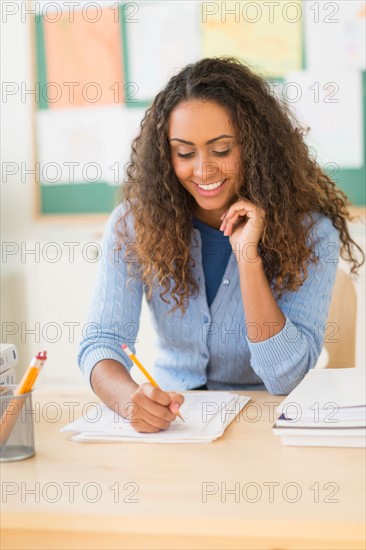 Portrait of elementary school teacher in class.