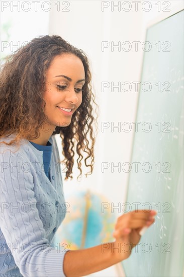 Portrait of elementary school teacher in class.