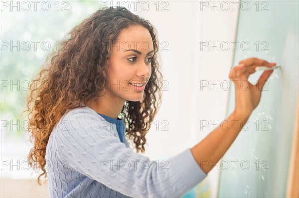 Portrait of elementary school teacher in class.