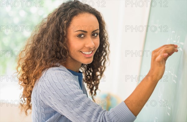 Portrait of elementary school teacher in class.