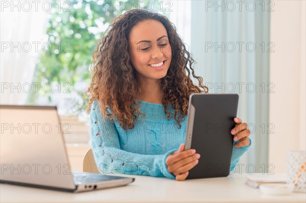 Young woman in home office.