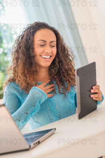 Young woman in home office.