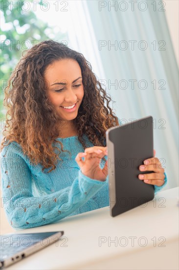 Young woman in home office.