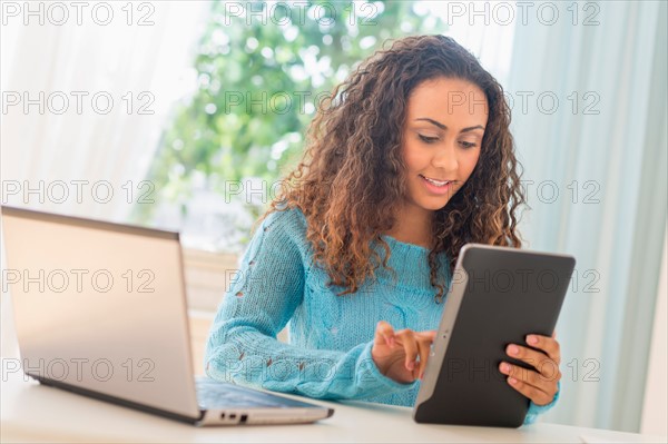 Young woman in home office.