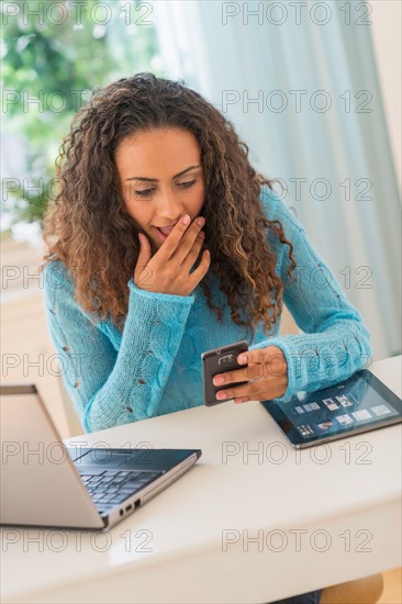 Young woman in home office.