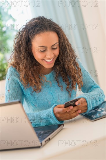 Young woman in home office.