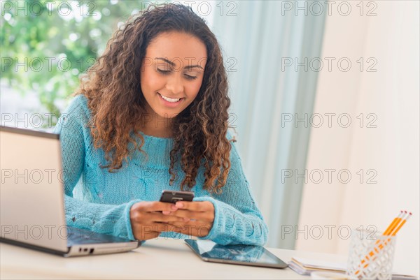 Young woman in home office.