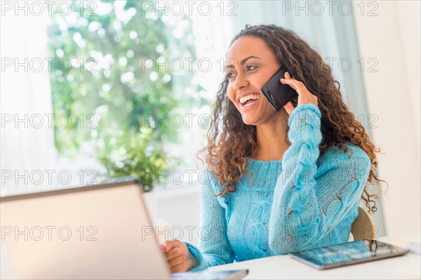 Young woman in home office.