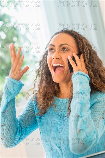 Young woman talking on phone.