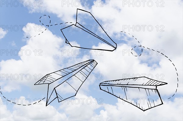 Paperplanes drawn on cloudy sky