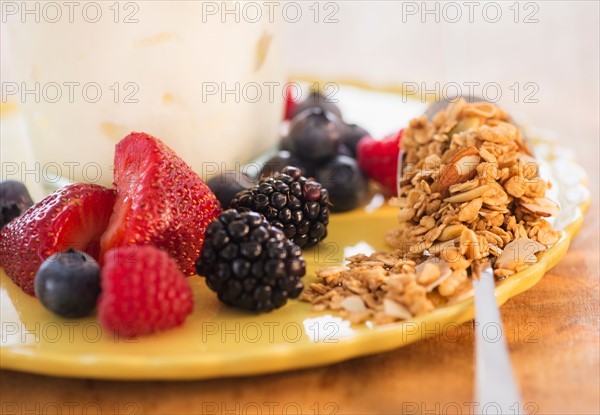Healthy breakfast with fruits, cereal and yoghurt