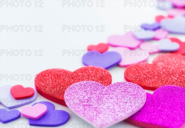 Studio Shot of foam hearts on white background