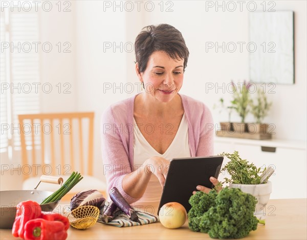 Portrait of mature woman in kitchen