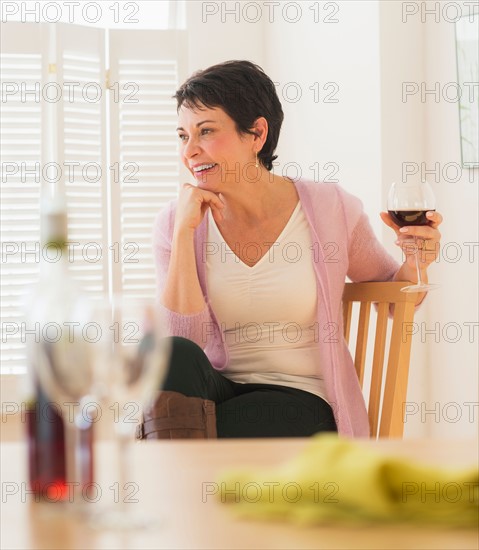 Portrait of mature woman holding wine glass