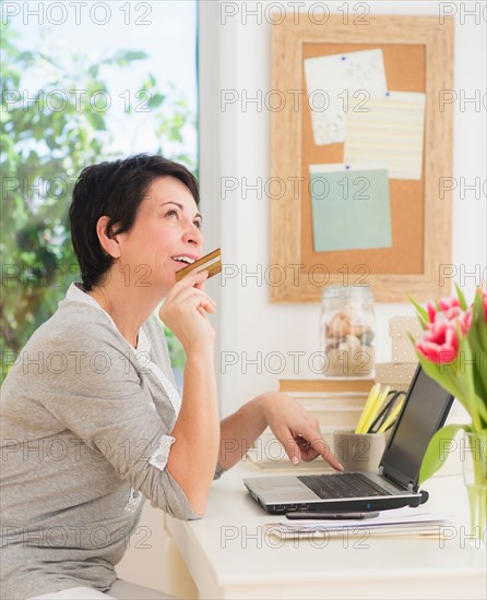 Mature woman doing online shopping