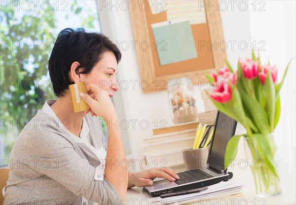 Mature woman doing online shopping