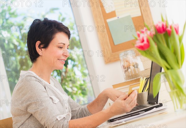 Mature woman doing online shopping