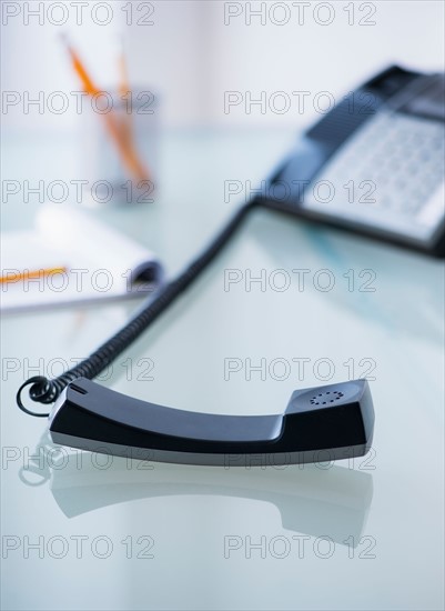 View of telephone and paper material on desk