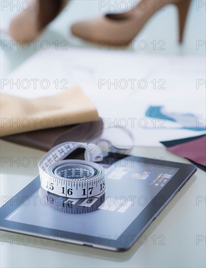 Studio Shot of digital tablet, tape measure and shoes