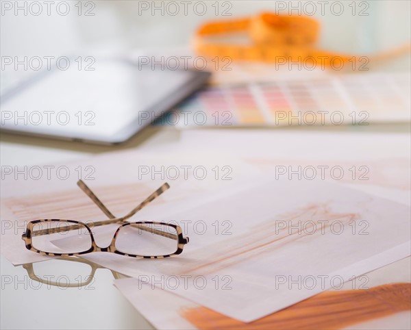 Studio Shot of digital tablet, sketch and spectacles