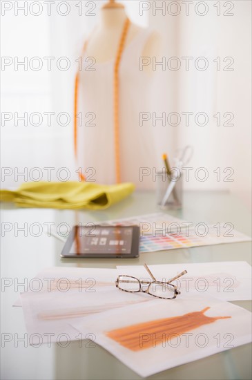 View of digital tablet, sketch and spectacles