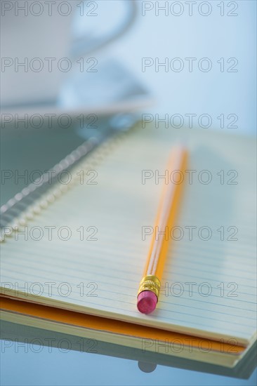 Studio Shot spiral-bound notebook and pencil