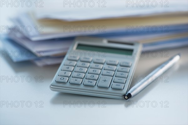 Studio Shot of calculator, pen and paper material