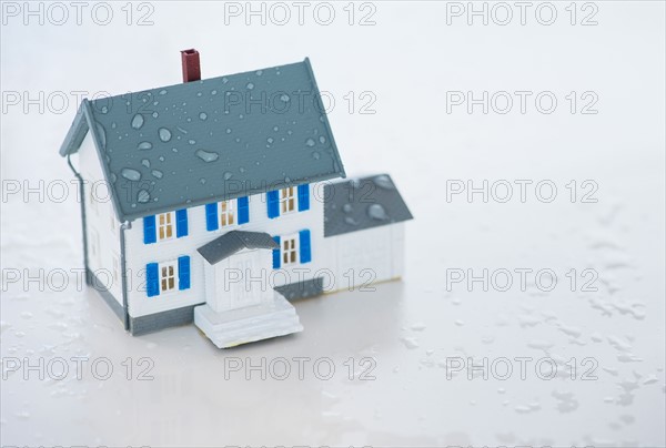 Studio Shot of artificial house during flood