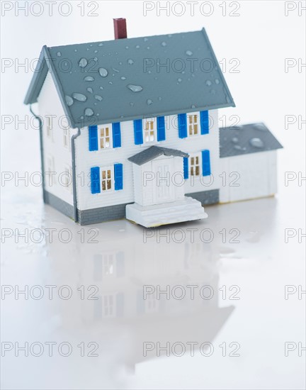 Studio Shot of artificial house during flood