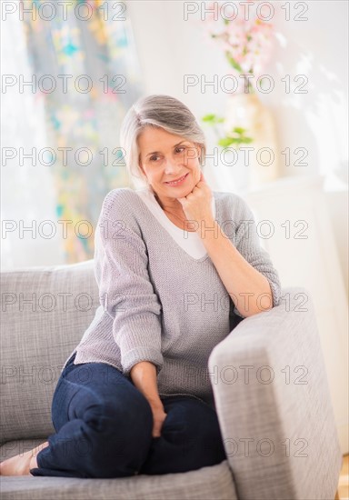 Portrait of woman relaxing on sofa