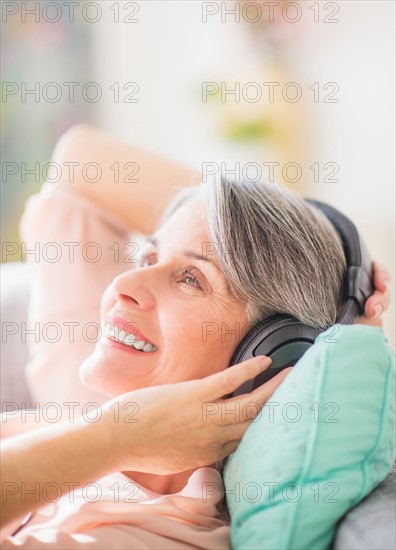 Portrait of woman listening to music