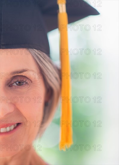 Portrait of woman in graduation cap