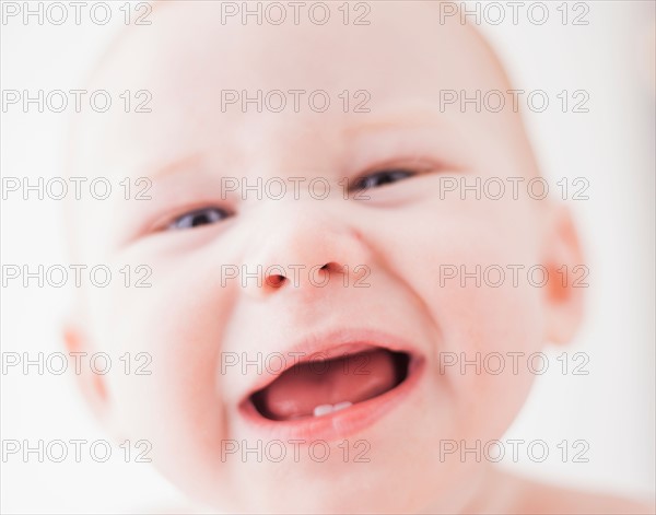 Studio shot portrait of baby boy (18-23 months) with open mouth