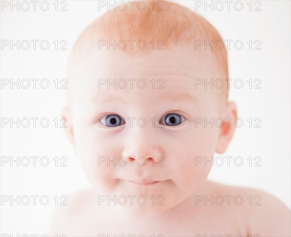 Studio shot portrait of surprised baby boy (18-23 months)