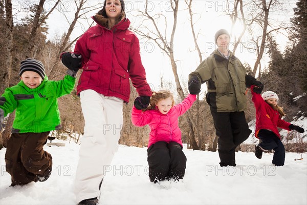Three children (2-3, 4-5) with parents during stroll