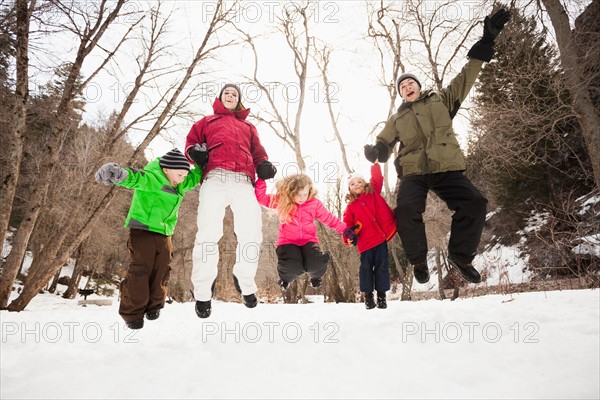 Three children (2-3, 4-5) with parents during stroll