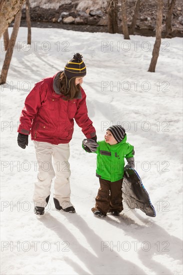 Portrait of young woman with boy (4-5) during stroll