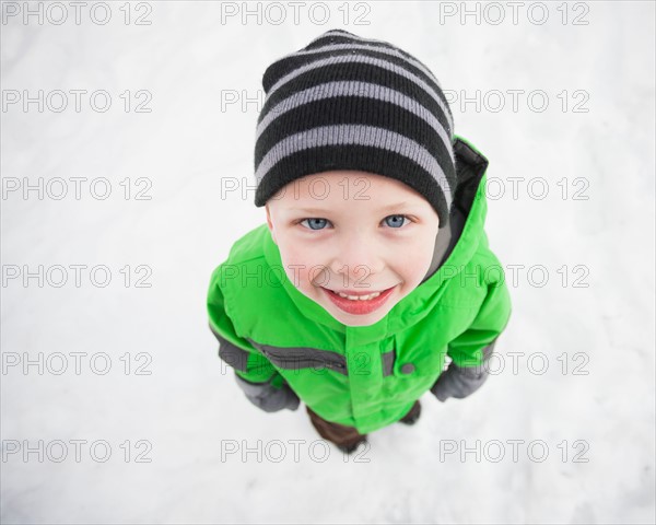 Directly above portrait of standing boy (4-5) looking up