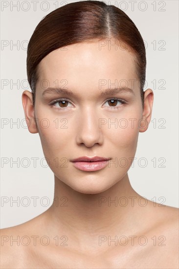 Studio shot portrait of young woman