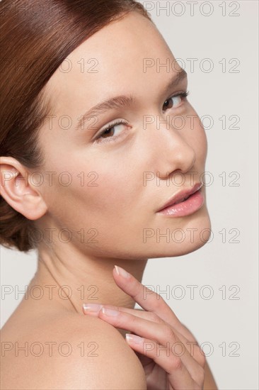 Studio shot portrait of young woman