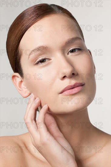 Studio shot portrait of young woman