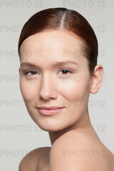 Studio shot portrait of young woman