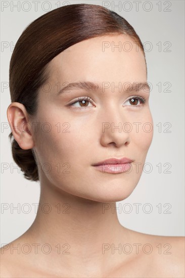 Studio shot portrait of young woman