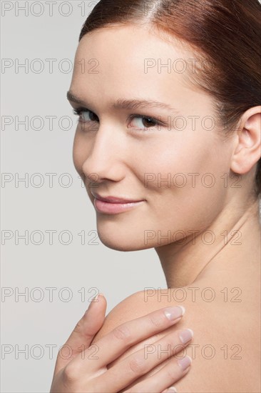 Studio shot portrait of young woman