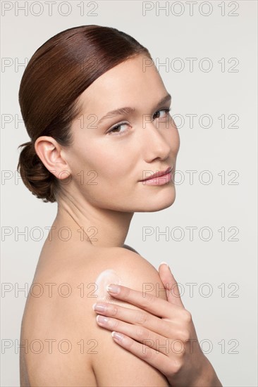 Studio shot portrait of young woman