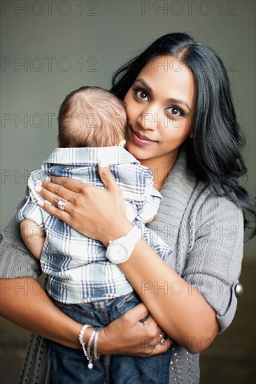 Mother holding her son (2-5 months)