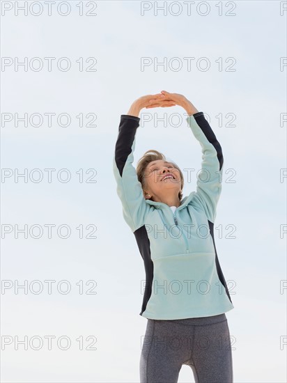 Senior woman stretching.