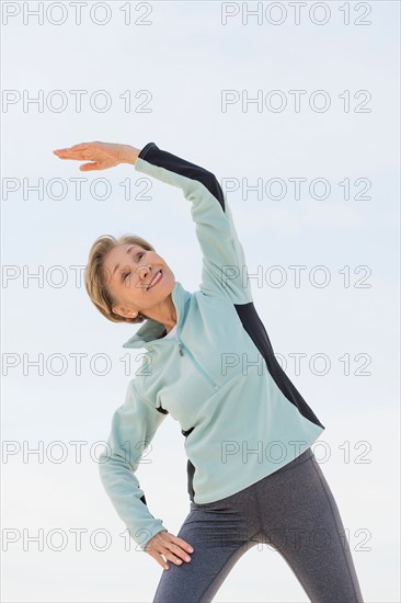 Senior woman stretching.